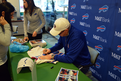 Jim Kelly signs autographs for fans at M&T Bank's Military Road branch. (Photos by Lauren Zaepfel)