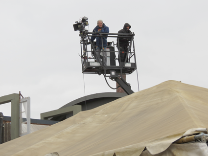 A camera crew works on the set of "Defiance." 