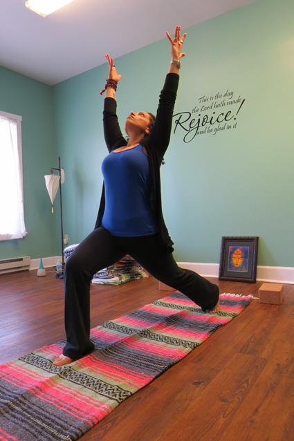Annie Rychlik practices yoga at her Down Dog studio in Lewiston.