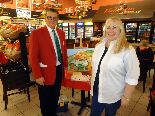 Anthony DiMino, president of DiMino Tops Lewiston, is shown with Michelle Marcotte in the carryout café where Marcotte paints.