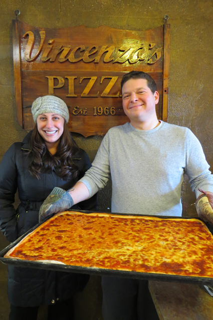 Sarina and David Munzi stand inside Vincenzo's Pizza House in Lewiston.