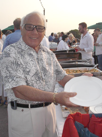 Russell J. Salvatore inspects the buffet line before his 300 guests indulge.
