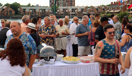 Russell J. Salvatore stands amidst partygoers at the July 4 event he sponsored.