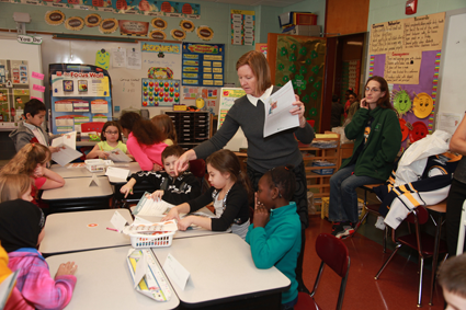 Elizabeth Gurney, executive director of the First Niagara Foundation, teaches students about financial literacy.