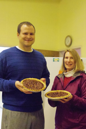 Suzanne Grafinger and her son-in-law Kyle Vuchak deliver homemade pecan pies.