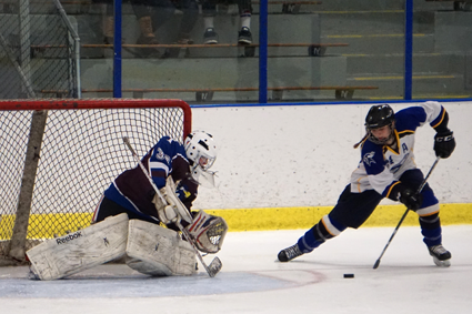 Olivia Smith scores the clinching goal in a 4-2 win for Kenmore/Grand Island over Orchard Park/Frontier. She sent a backhander into the roof of the net over OP/Frontier goalie Victoria Cottrell. (Photo by Larry Austin)