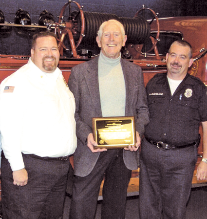 Dr. Edward Rayhill is flanked by past Grand Island Fire Chief Greg Butcher, left, and EMS captain Bob Cleveland.