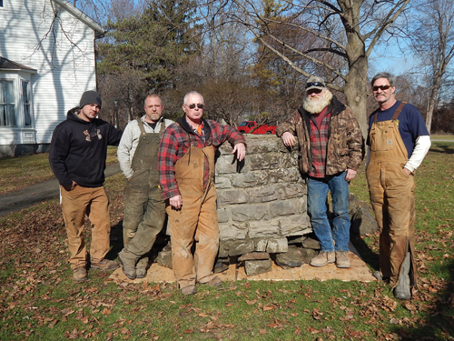 The LDC Construction crew poses near the well they recovered Feb. 2 from the Niagara River and moved into place at the River Lea mansion. From left, they are: Lyle Szapakowski, Greg Dinsmore, Mike Szapakowski, Jeff Dinsmore and Dan Dinsmore.