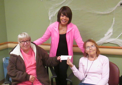 Pictured with the $550 American Cancer Society donation check are, from left, Niagara Falls residents Karen Armbruster, Williamson and Millie Harris.