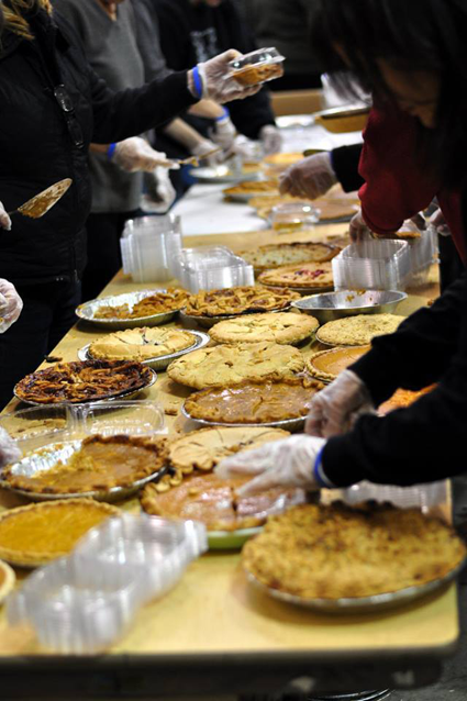 Many hands working together to prep pies at last year's 