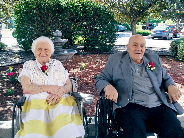 Tom and Rose Giangreco relax near the front garden at Northgate Health Care Facility in North Tonawanda before heading off to an anniversary dinner at one of their favorite restaurants. (Photo courtesy of Northgate)