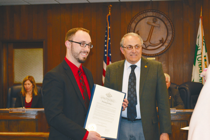 Mike Zimmerman (left) receives a proclamation from Mayor Art Pappas.