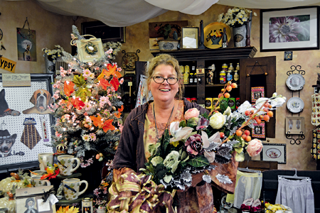 Holly Rankie, owner of Hip Gypsy on Webster Street, displays decor she is placing in her storefront for Winter Walk, made by one of her customers, Maria Waselus of North Tonawanda.