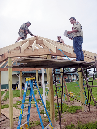 Rob Dunn, Zachary Spaulding and Matt Jackson work on a gazebo recently on the grounds of the Sanborn-Lewiston Farm Museum, Saunders Settlement Road. Jackson organized the project as a tribute to his grandmother, the late Linda Jackson. (Photo by Jill Keppeler)
