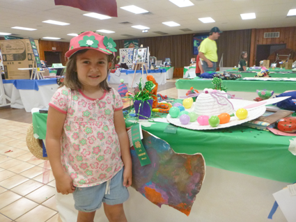 Mariana Martin, 5, of Sanborn shows off some of her craft items on display Friday at the Niagara County Fair. It's her first year as a 4-H Cloverbud.