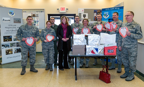 Airmen and women showcase their Valentine's Day cards presented by Erie County Legislator Lynne Dixon. The cards were made by children from more than 35 Erie County schools. (U.S. Air National Guard photos by Staff Sgt. Ryan Campbell)