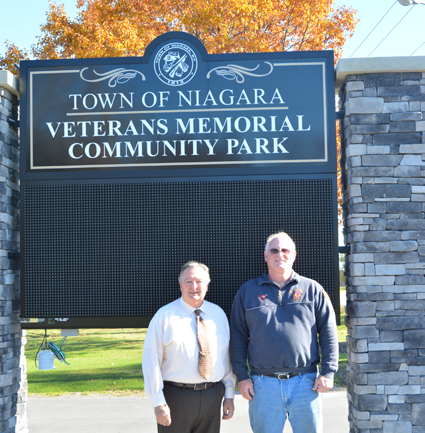 Town of Niagara Supervisor Lee Wallace (left) stands with Mark Dembitsky of Town of Niagara Active Hose Co. in front of the soon-to-be finished sign for the newly named 