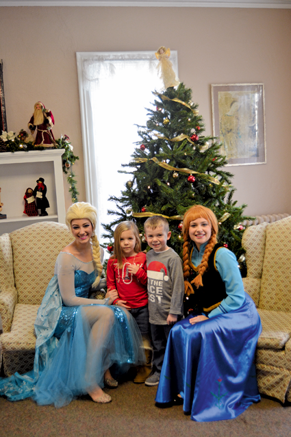 Posing for a photo with Disney's "Frozen" stars Anna and Elsa.