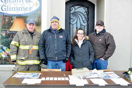 Members of Sweeney Hose Co. No. 7 sell raffle tickets for the "A Christmas Story" event to raise money for the firehall. From left: Joe Lavey, Peter Schenier, Jamie Doeing and Kyle Reeves.