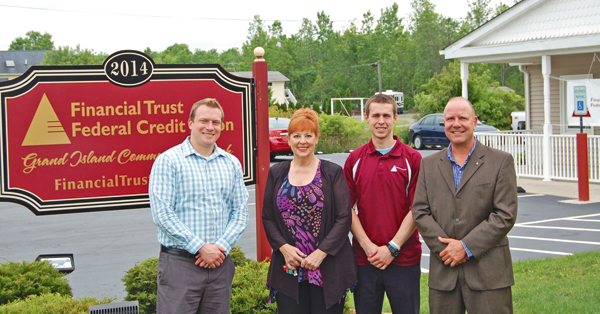 Financial Trust Federal Credit Union. From left: Jack Keefe, loan officer; Kinney; Jason Guether, member service representative; and John Morrison, CEO.