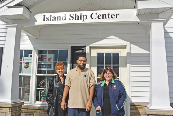 Island Ship Center (right): Kinney, Fahim Mojawalla, owner of Island Ship Center; and McMahon.