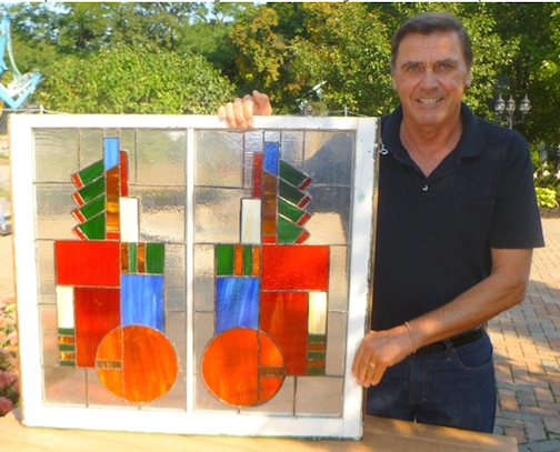 Artist Gene Kulbago with his stained glass `Frameworks` piece.