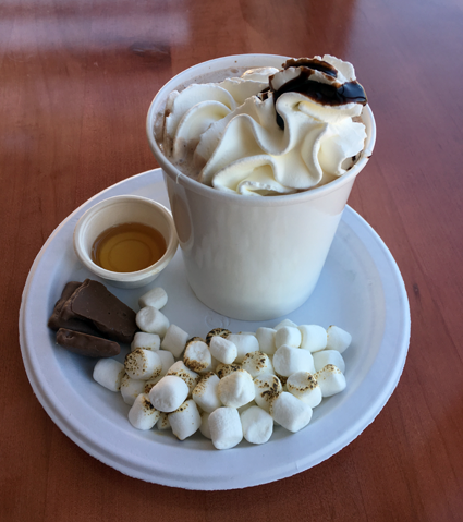 One of Lake Effect's new Warm Front Floats, called Chocolate S'more, features frozen hot chocolate ice cream with hot chocolate, toasted marshmallows, chocolate-covered graham crackers, and a side of syrup.