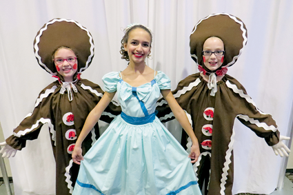 Gingerbreads Natalie Dunlap, 9, and Madison Sabourin, 10, both of Niagara Falls, flank dancer Isabella Guerrucci, 12, of Lewiston.