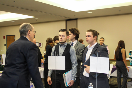 NU students David Yarger and James Burns speak with CNHI publisher Chris Voccio.
