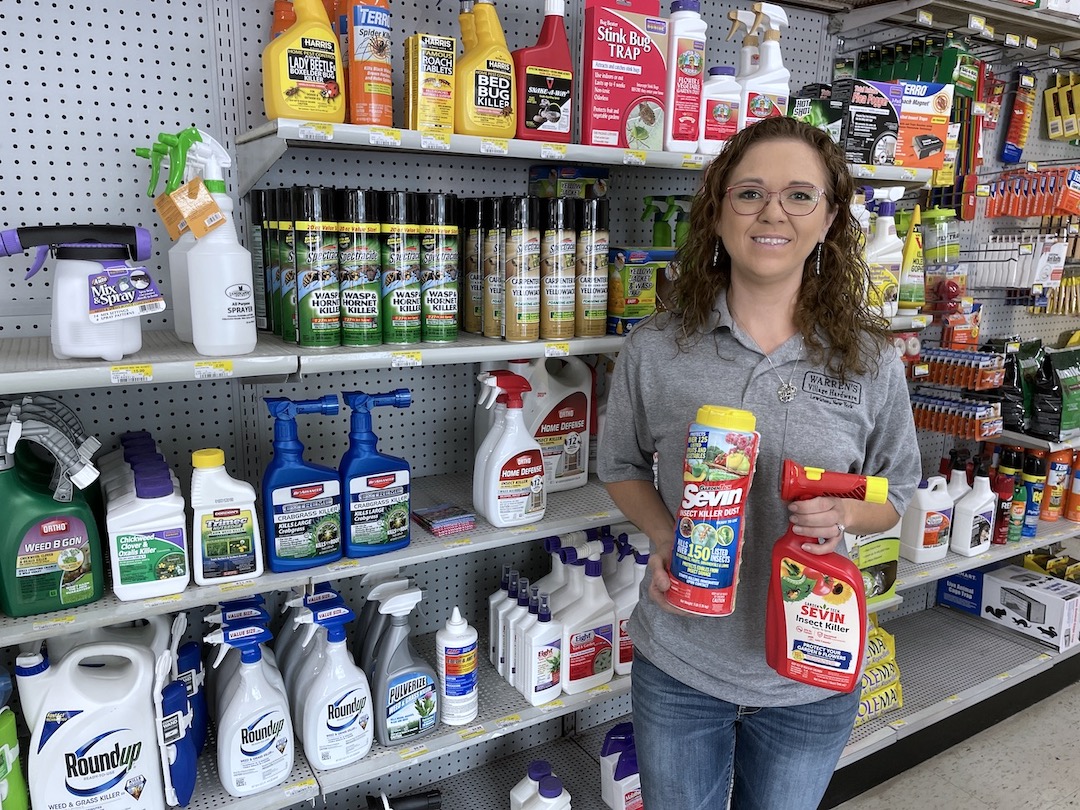 Warren's Village Hardware, at 185 Portage Road, Lewiston, carries a variety of insecticides. Ashley Warren is shown with some of the products.