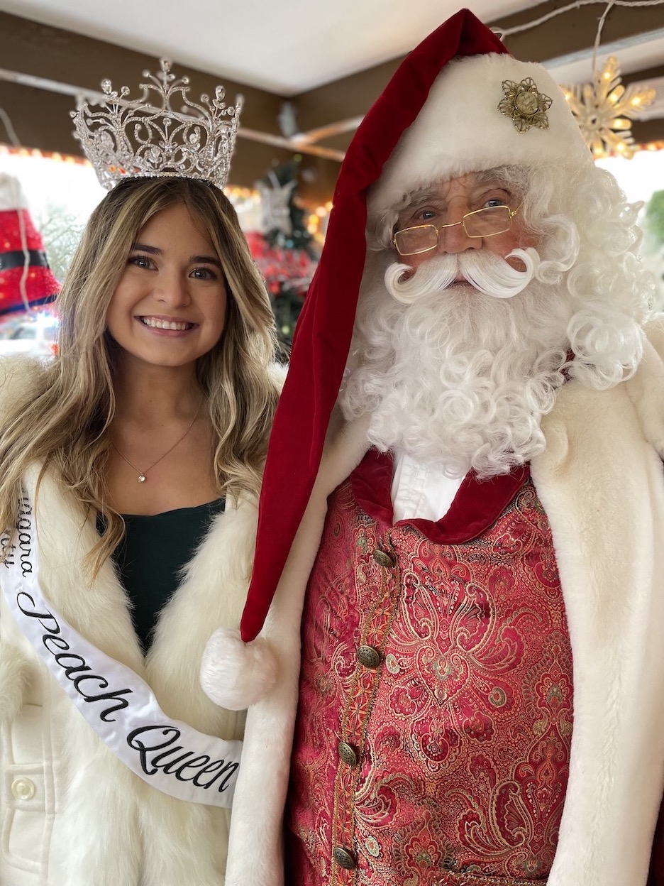 Santa Claus and his best helper, 2023-24 Niagara County Peach Queen Kirsten Ferree.