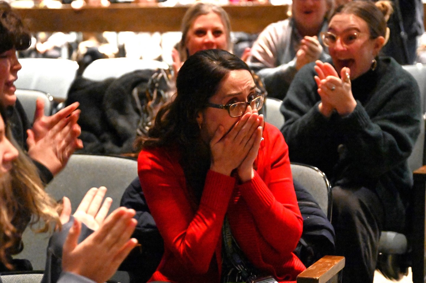 Seventh grade science teacher Kimberly Alexander Carlo is stunned to learn that this entire assembly was set up to honor her—she is New York's 2023-24 Milken Educator. (Photo credit: Milken Family Foundation)