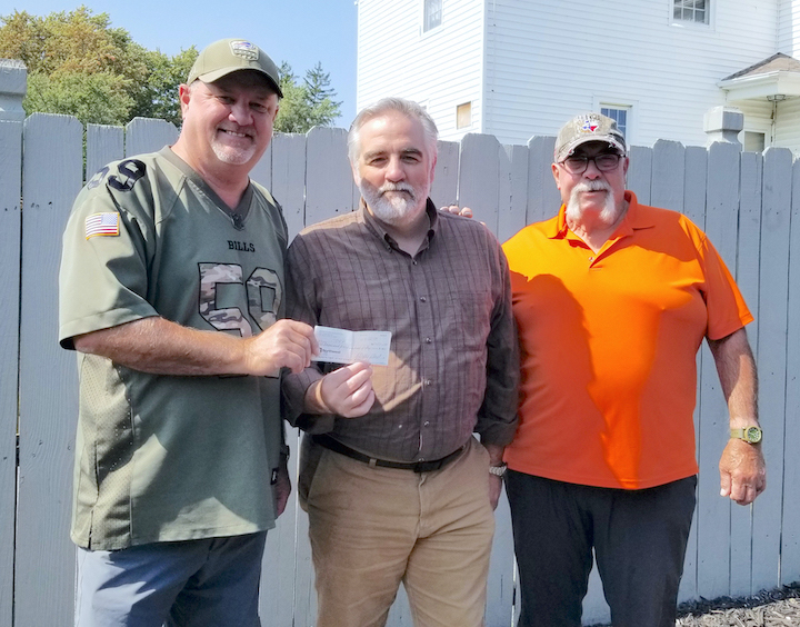 In the photo, from left, Porter Supervisor `Duffy` Johnston; Tom Guagliardo of North Tonawanda, executive director of the Juvenile Diabetes Research Foundation for Upstate New York; and fishing guide Ernie Calandrelli of the 3F Sportsmen's Club at a recent check presentation. (Photo by Terry Duffy)