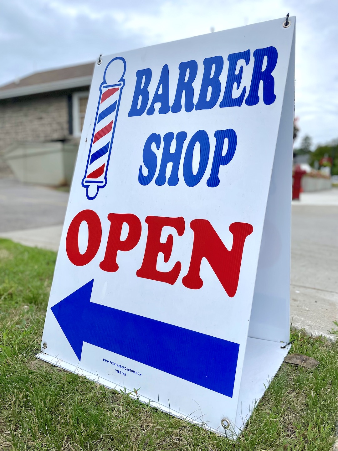 The Vintage Barber uses a `sandwich board` sign to attract customers.