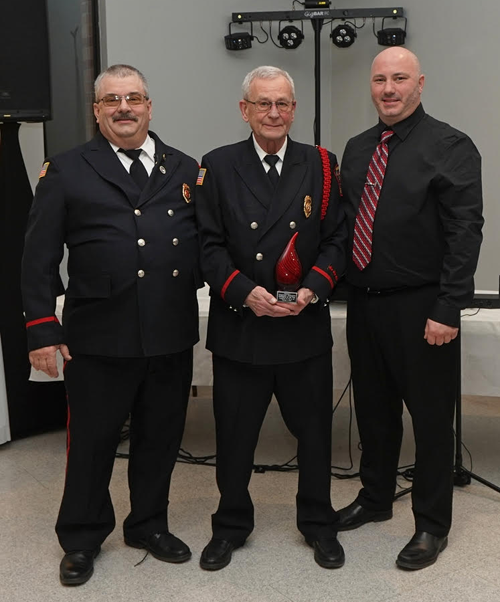 Chief Eric Wieland, left, is shown with 2022 Fireman of the Year honoree Timothy Fogarty and Greg Quarantillo, fire company assistant chief. (Photos by Kevin and Dawn Cobello, K&D Action Photo and Aerial Imaging)
