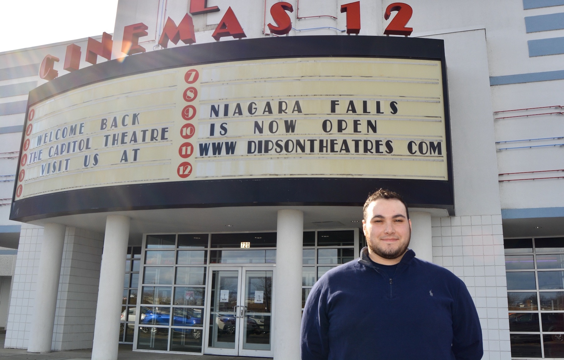 Jordan Clement, division manager for Dipson Theatres, stands outside of the new Capitol Theatre in Niagara Falls.
