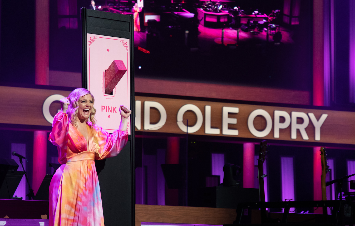 Lauren Alaina flips the switch to turn the Opry's signature barn pink for the annual `Opry Goes Pink` to support the fight against breast cancer. (Photo credit: © Grand Ole Opry, photo by Chris Hollo)