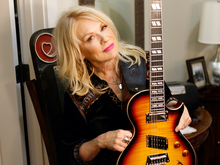Nancy Wilson with the new Epiphone guitar named in her honor. (Photo by Krista Gilley/Gibson Brands, courtesy of Prime PR Group)