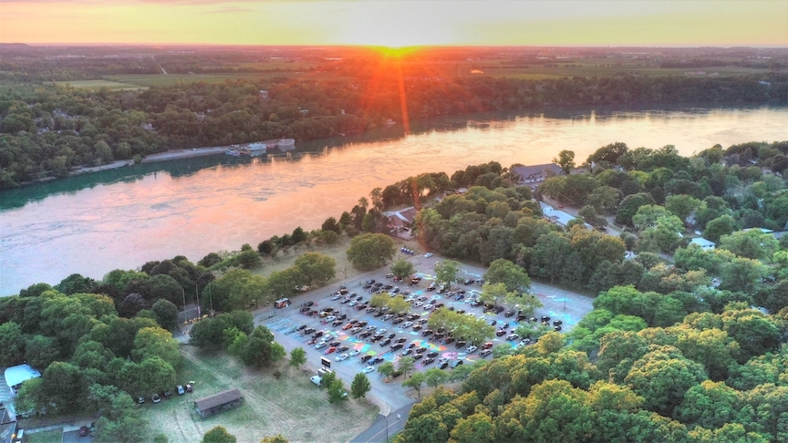 Cars filled the Artpark main parking lot last summer to watch `The Tragically Hip: A National Celebration.` The film will be shown again this summer, but on a giant screen inside the park. (File photo by K&D Action Photo and Aerial Imaging)