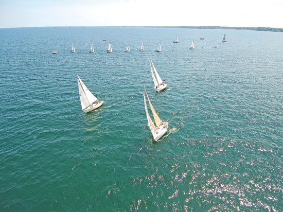 Shown are drone shots of the Ideal 18s in racing competition out in Lake Ontario. Check out these and more at the major title-sponsored Dyneema CanAm Challenge and LYRA Race Week starting next weekend.