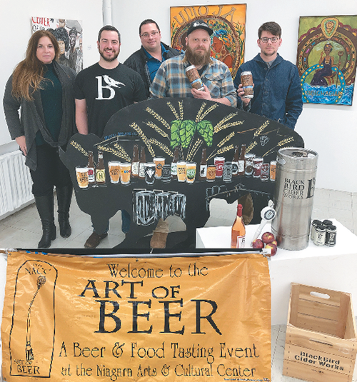 Pictured, from left, inside the main art gallery at the NACC, are Jill Nykkei of Belly Dance Academy, Phil Gigliotti of BlackBird Cider Works, Mike Shimmel of Rise Up Breads & Bakery, and John Meteer and Thomas Winter of Brickyard Brewing Company.
