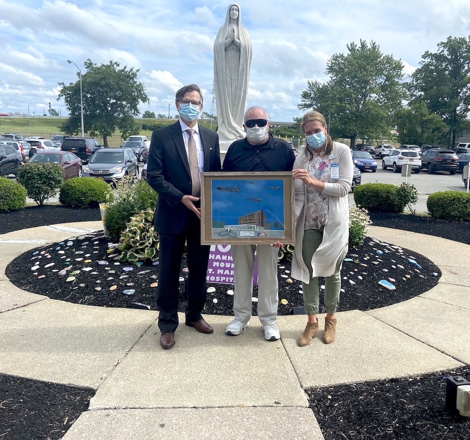 Pictured, from left, are CJ Urlaub, Mount St. Mary's Hospital President and Catholic Health Senior Vice President of Strategic Partnerships, Integration & Care Delivery-Niagara County; artist Arthur Jones; and Julie Berrigan, Mount St. Mary's Hospital Foundation executive director.
