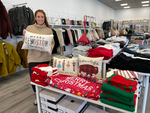 Mari Salada shows off some of the holiday merchandise available at Research and Design, located at 721 Center St. - inside the former HSBC Bank. RD is one of the Lewiston Christmas Walk sponsors, and will offer live music Sunday afternoon ahead of the Lewiston Christmas Lights Parade.