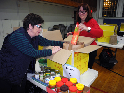 Volunteers worked diligently last year to provide items for those in need. (File photo)