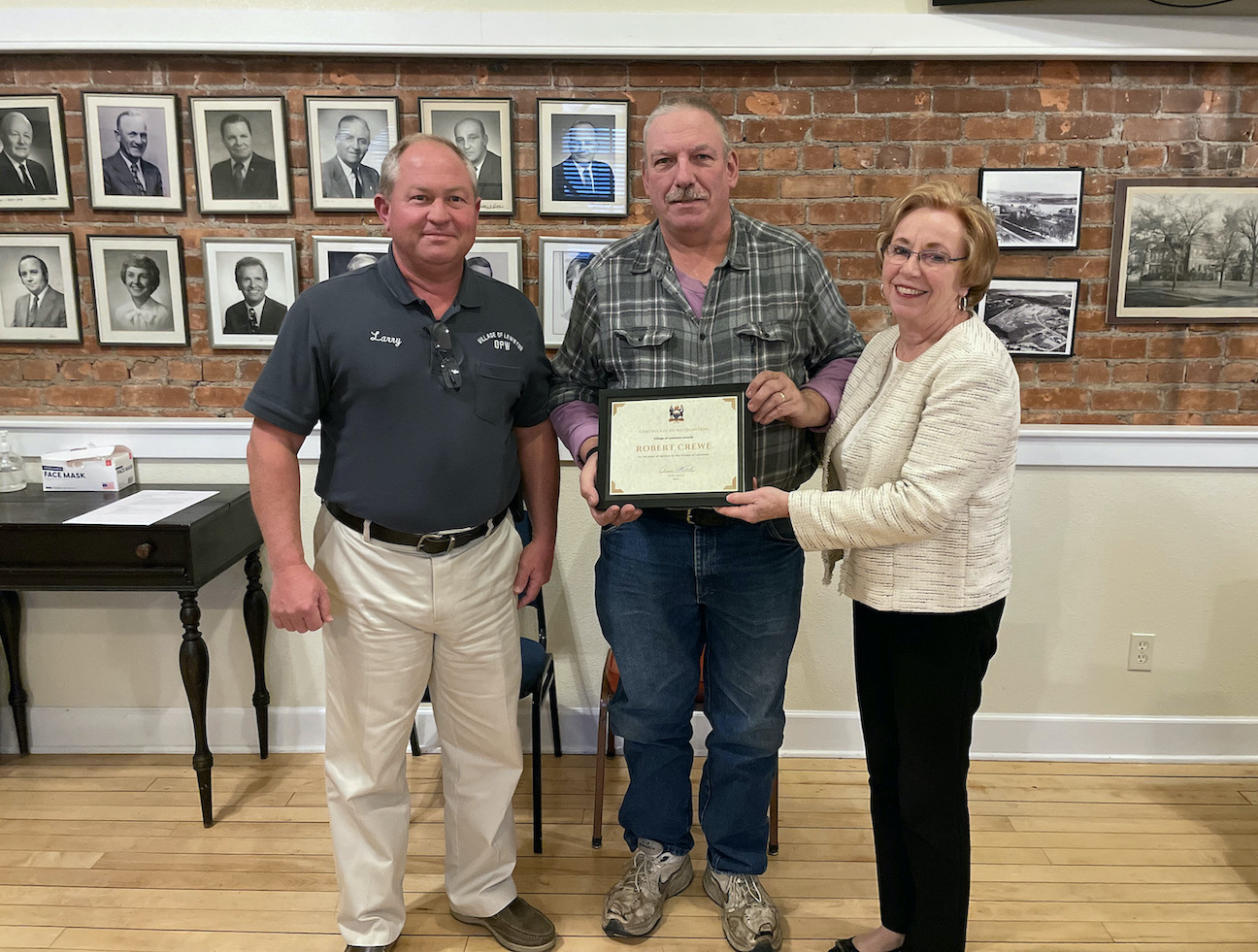 Pictured, from left: Department of Public Works Superintendent Larry Wills, Robert Crewe and Mayor Anne Welch. Crewe was recognized for 30 years of service to the village.
