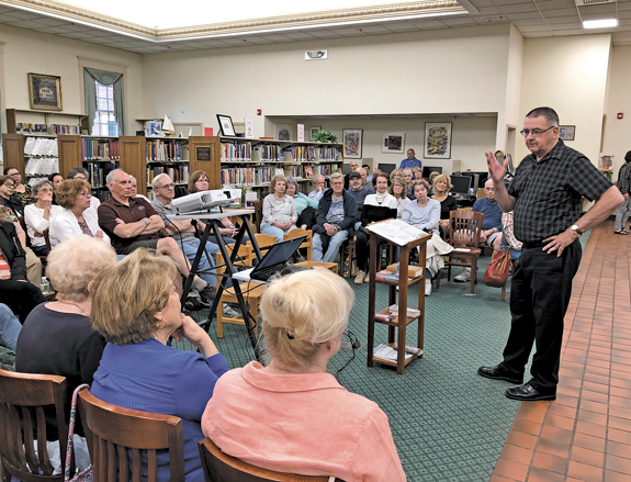Ken Slaugenhoupt chronicles the history of the Frontier House to a captive Lewiston Public Library crowd.