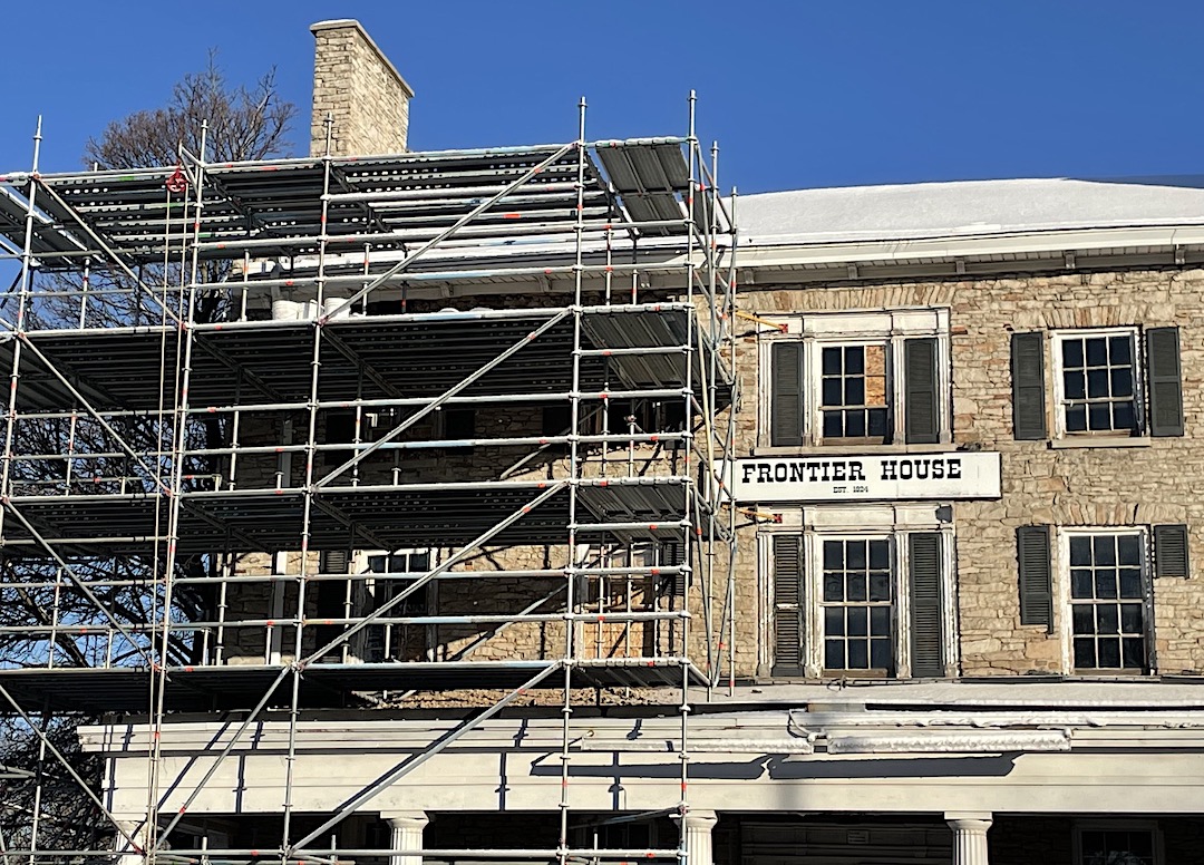 Pre- and post-snowstorm, construction crews have diligently worked to repair the exterior of the Frontier House in Lewiston.