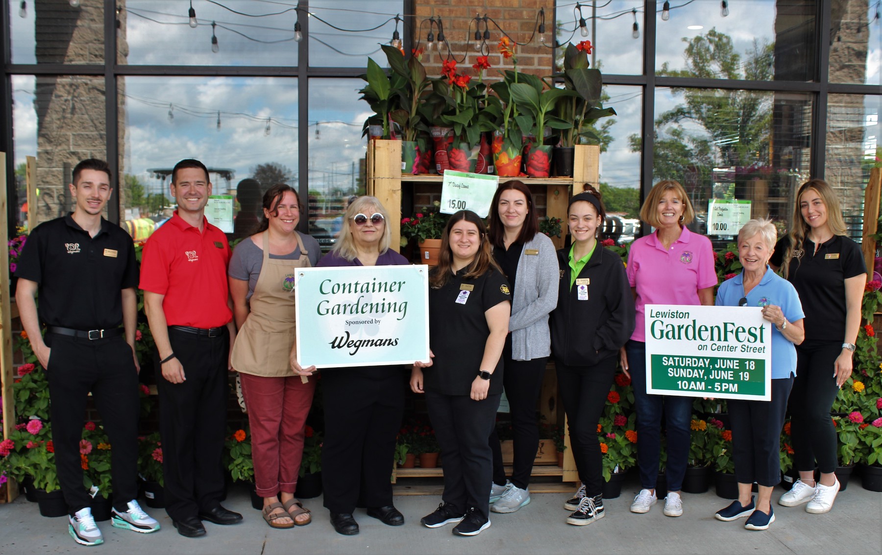 Wegmans is the sponsor of the container garden contest, which will be held in Hennepin Park. From left: Michael, Kevin, Nicole Johnson, Kay Kalick, Katie, Tiffany, Shanya, Judy Talarico, Barbara Carter and Toni. (Photo by Robert Albee)