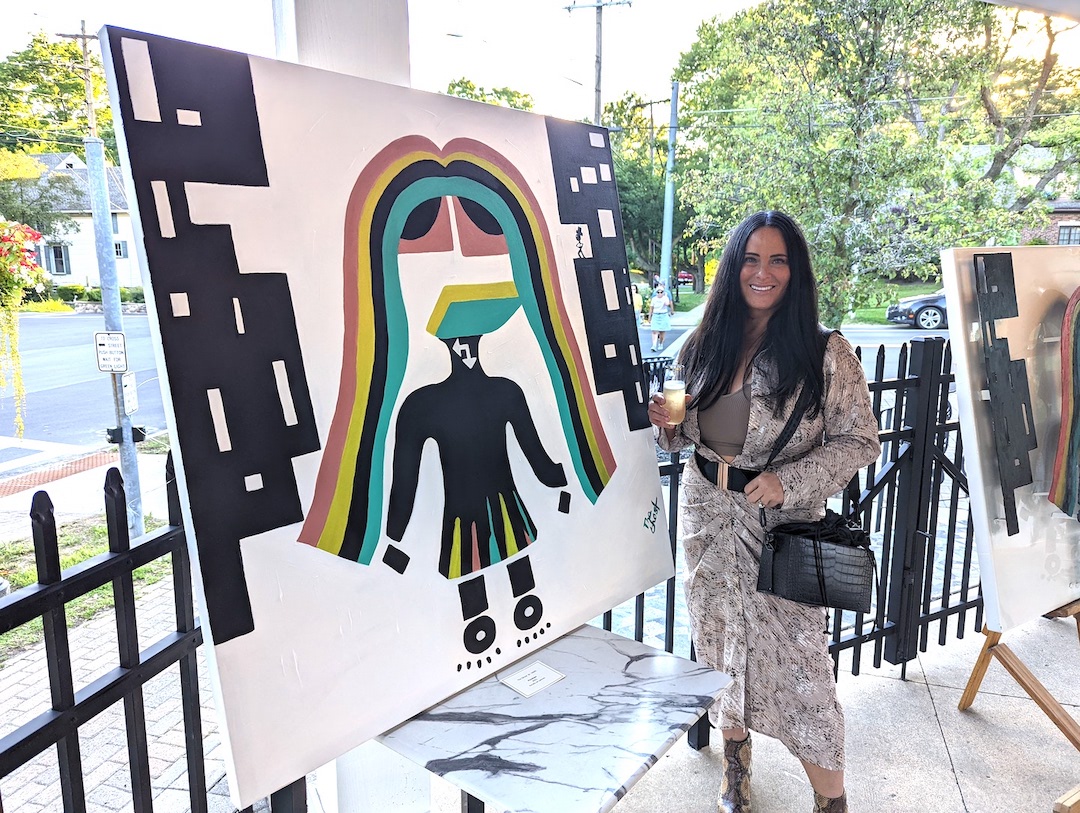 Artist Patti Thomas created a number of paintings displayed at Gallo Coal Fire Kitchen in Lewiston on Friday, July 29. The event was meant to help Thomas gain exposure in the Niagara County art scene, according to Gallo owner Michael Hibbard. (Photo by Timothy Chipp)