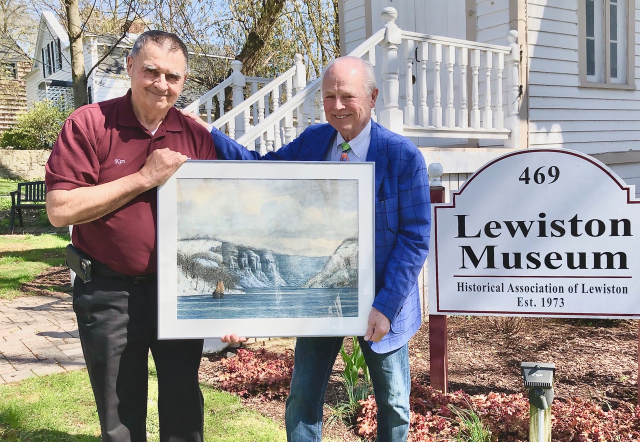 Ken Slaugenhoupt, left, president of the Historical Association, holds the Frontenac painting with Dr. Michael Hess of Lockport, who owns the one-of-a-kind artwork.